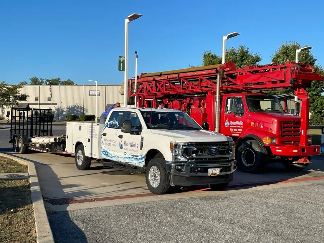 HydroWells drill rig and service truck on a Maryland well job