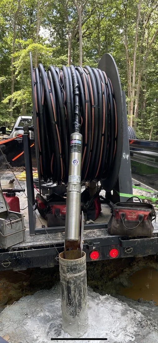 Pump hoist reel used to pull and set well pumps