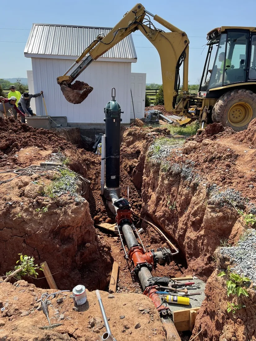 Trench connecting well lines from the borehole toward the house
