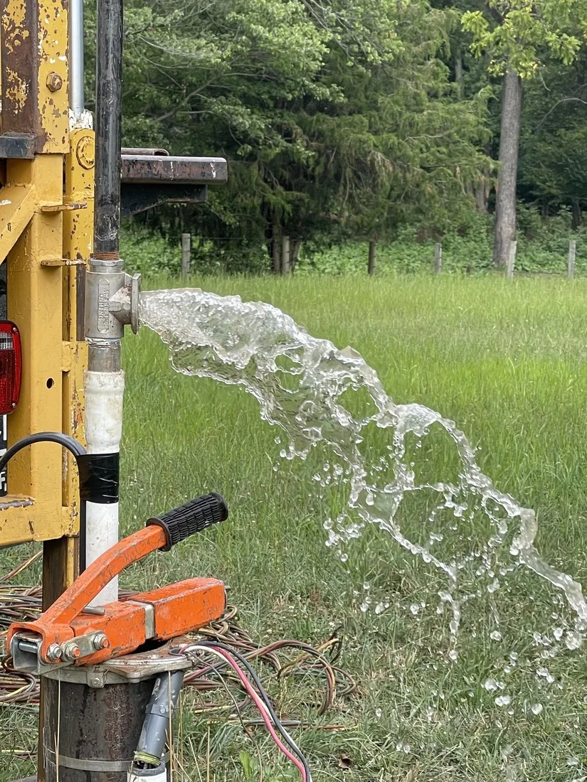 Water surging from a well casing during hydrofracking work