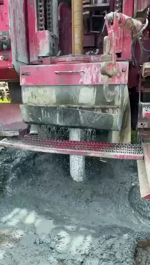Sediment and slurry surged out of the well casing at the rig during well redevelopment